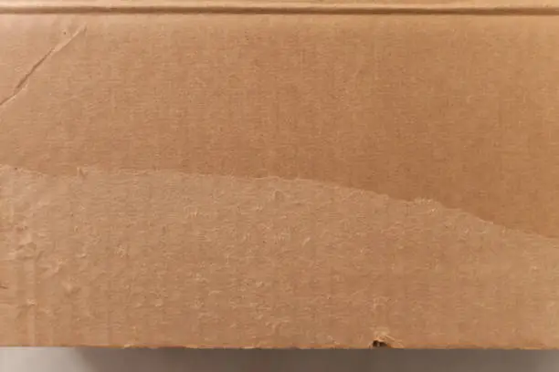 Detail of an unwritten cardboard box. With copy space and space for text. Box concept. Packaging concept.