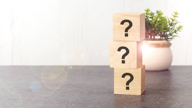 istock question marks on wooden dice standing on top of each other 1412292812