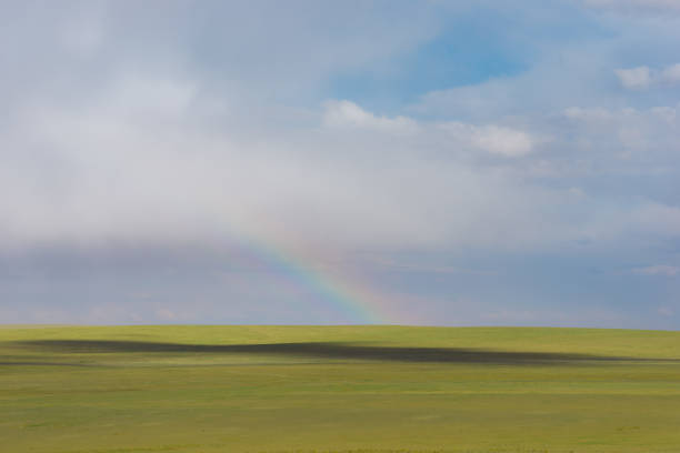 Double rainbow landscape in beautiful landscape scenery taken on sunny and rainy day.
