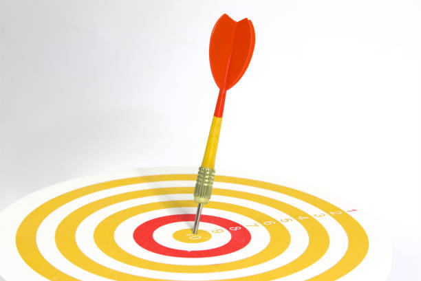 istock Close up  yellow darts target on bullseye background, 1412305291