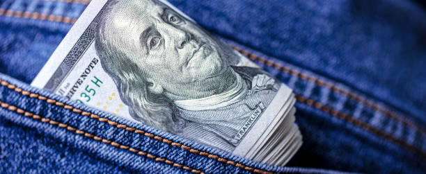 istock Dollar bills in jeans pocket 1412306477