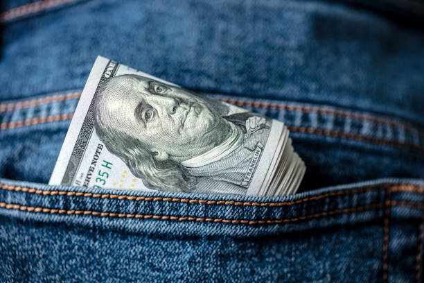 istock Dollar bills in jeans pocket 1412306489