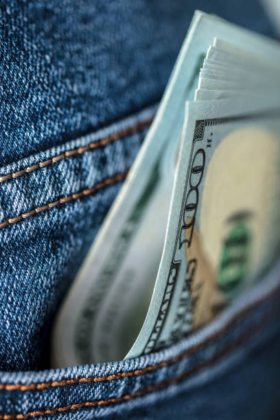 istock Dollar bills in jeans pocket 1412306513