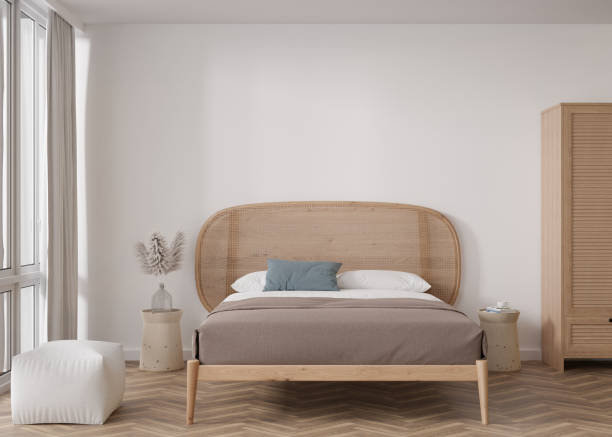 istock Empty white wall in modern bedroom. Mock up interior in scandinavian, boho style. Free, copy space for your picture, text, or another design. Bed, pampas grass. 3D rendering. 1412307839