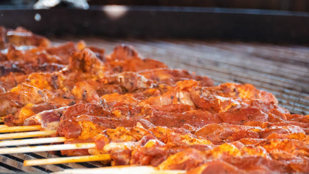 istock Tasty oriental shashlik skewer cooking over an open fire 1412308180
