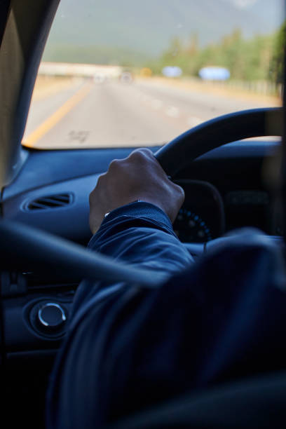istock person driving canada roads sunny day 1412308420