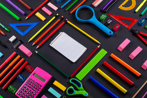 School Supplies On Black Background.