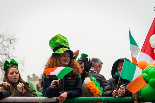 London, United Kingdom - March 13, 2022: People celebrating at London's St Patrick's day parade 2022
