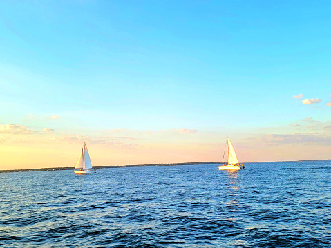 Sailboats on sunset cruise in the Intracoastal Waterway between Wolf Bay and Ono Island, Orange Beach, Alabama
