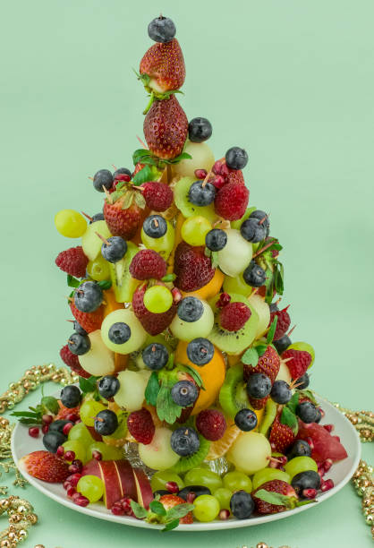 istock Fresh mixed fruits christmas tree shape 1412314638