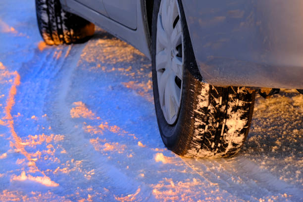 istock Snow Tracks from Car Tires in Snow During Winter 1412322765
