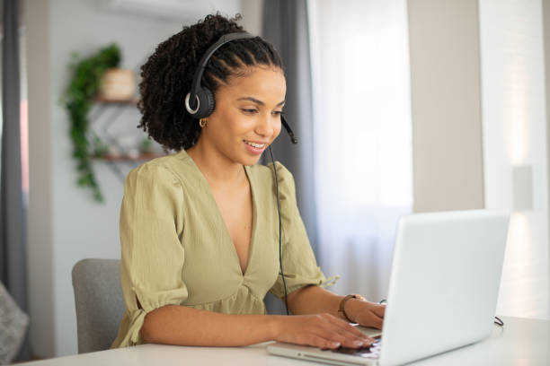 istock Young businesswoman working in a call center 1412329105