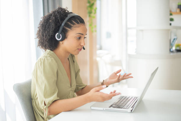 istock Young businesswoman working in a call center 1412329152
