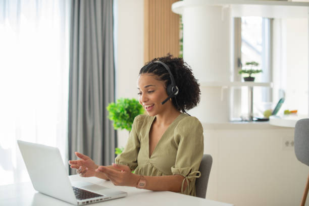 istock Young call center agent working in an office 1412329185