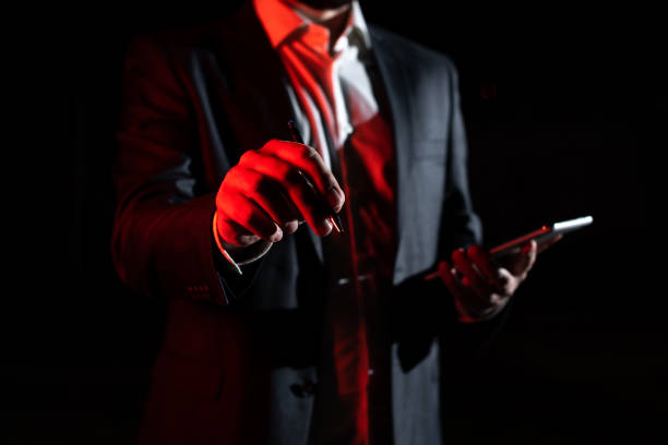 istock Businessman Holding Tablet And Pointing With Pen On Important Message. Executive In Suit Presenting Crutial Information. Gentleman Showing Critical Announcement. 1412329208