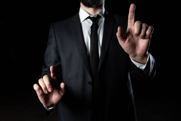 istock Businessman Pointing Crutial Informations With Two Fingers. Man In Suit Presenting Recent Updates. Executive Showing Important Announcements. Entrepreneur Displaying New Ideas 1412329214