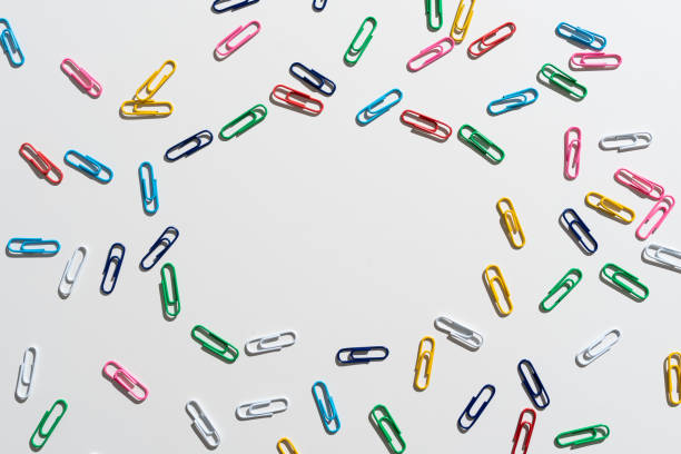 Colored Clips Arranged In Circle With Crutial Announcement Inside.