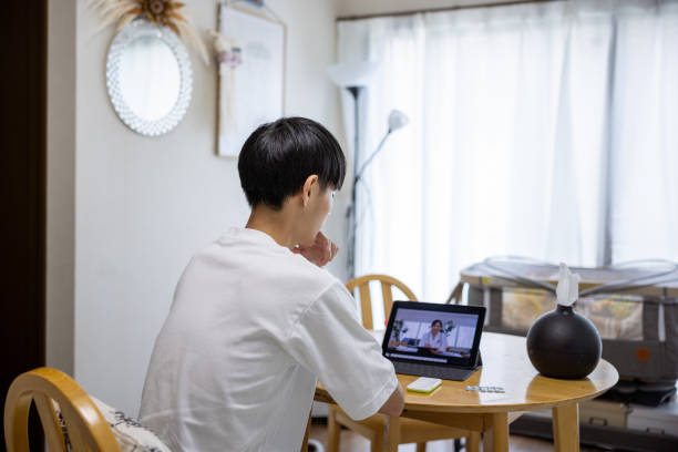 istock Man getting advice from female doctor through web conference 1412333644