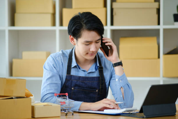 istock Asian business owner always keep contact with customer. 1412338242