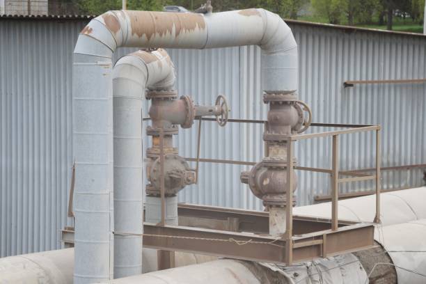 istock Tie-in to the main pipeline. Thin pipes extending from the main pipes. 1412340247