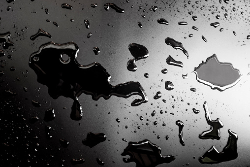 Liquid water on a black background.