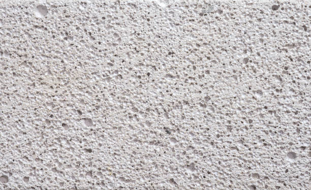 Details surface porosity white concrete wall.