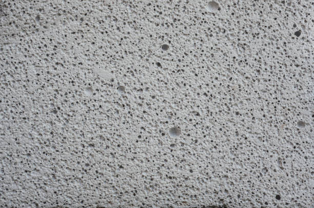 istock Close-up porous pattern of white concrete surface. 1412341811