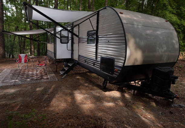 istock Camping trailer set up with both awnings out 1412341922