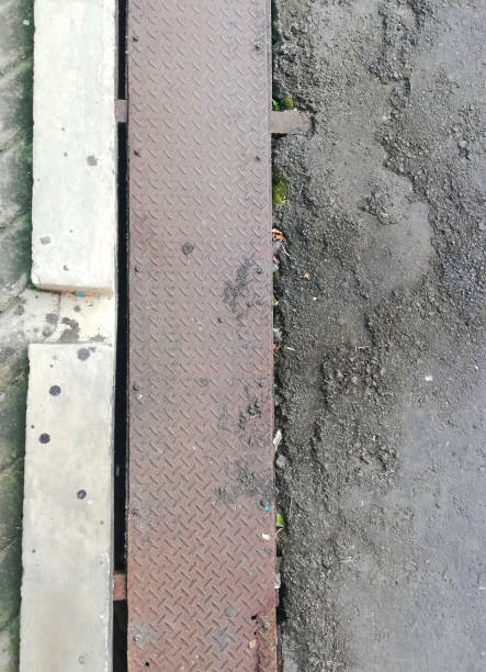 istock Drainage system at the road,with metal material cover 1412342421