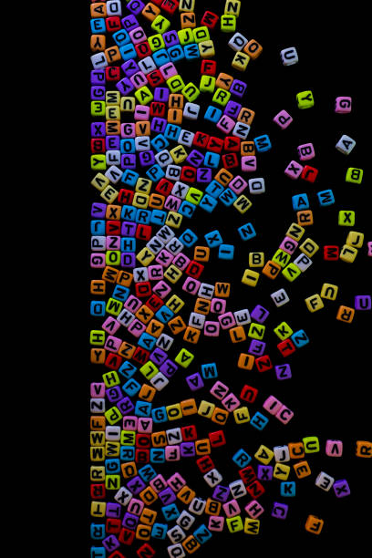 istock Bright, colorful English letters scattered. Is on a black backgr 1412344321