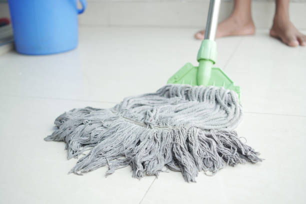 istock cleaning tiles floor with mop 1412344377