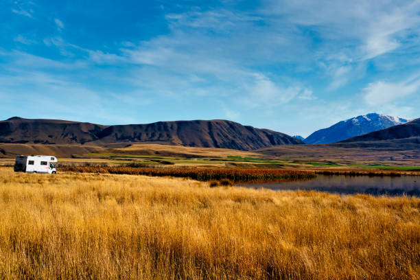 Remote small lakes beneath the foothills of the Southern Alps Stopping for a rest in my motorhome at the small Maori Lakes on the road to Lake Heron, in the Ashurton Lakes district akaishi mountains stock pictures, royalty-free photos & images