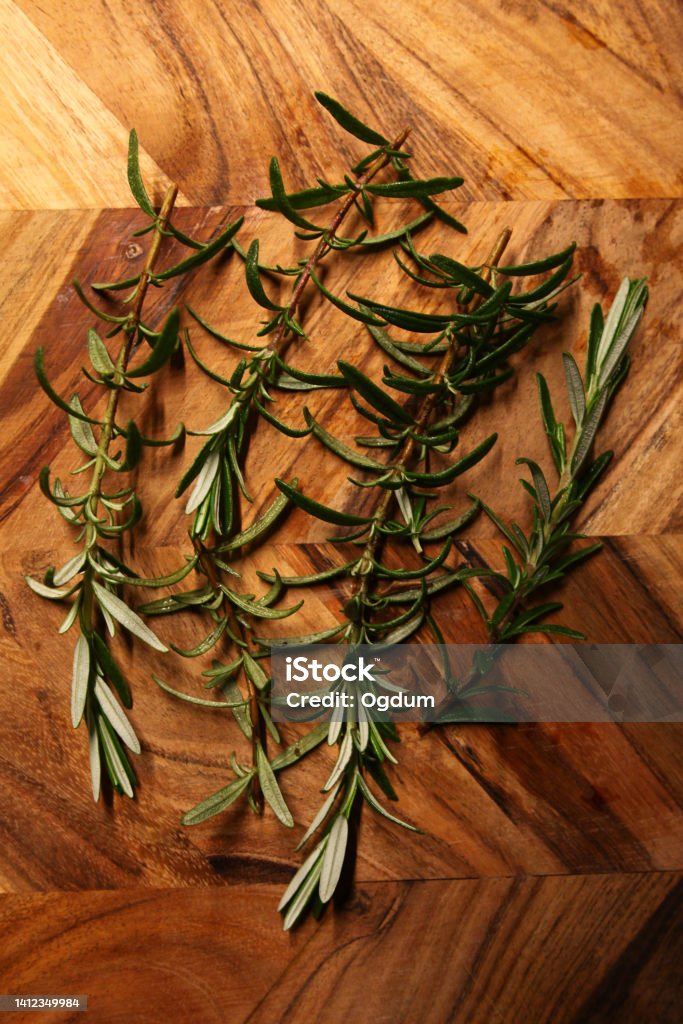 Rosemary branches Fresh rosemary branches on the board. Antioxidant Stock Photo