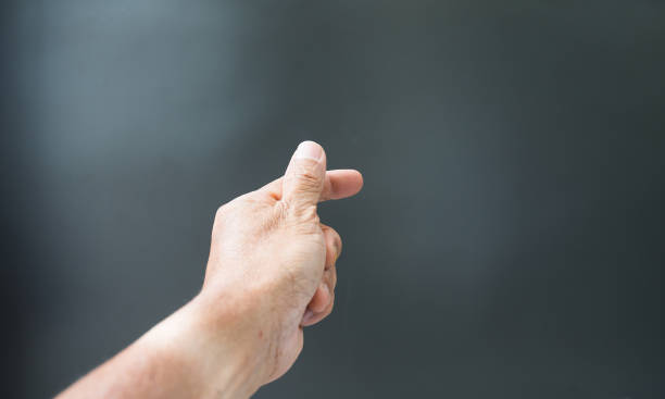 istock Finger gestures and wrinkled hands On a gray background 1412350479
