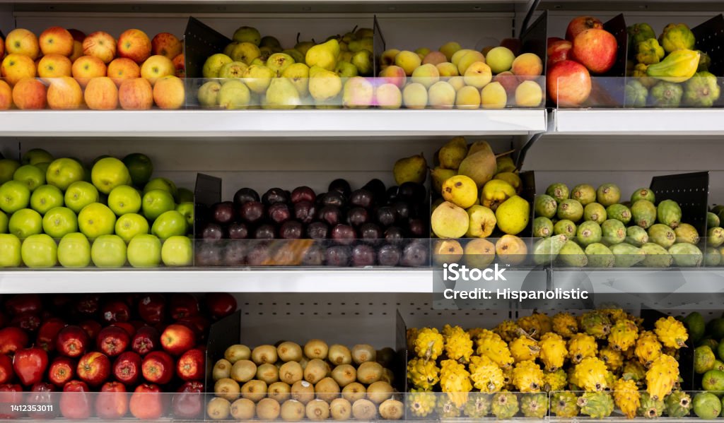 Fresh fruits on the shelves at a supermarket Fresh fruits on the shelves at a supermarket - grocery shopping concepts Fruit Stock Photo
