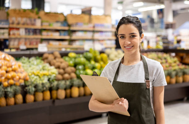istock Retail clerk working at a supermarket doing the inventory 1412353060