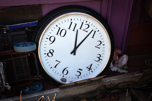 Old clock face with roman numerals isolated on white. Related: