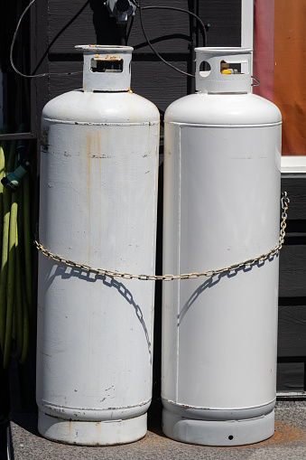 Two propane tanks outside a building.