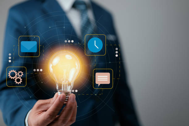 istock Concept for a business idea, action plan, and solution. A businessman with a plan and a metaphor using a light. for a project, or start-up, fresh thinking, creativity, or innovative ideas. 1412359930