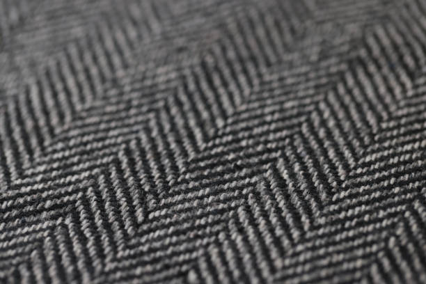 istock Closeup of black and white herringbone fabric 1412363116