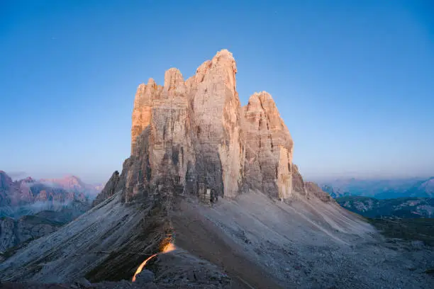 Photo of Stunning view of the Three Peaks of Lavaredo, (Tre cime di Lavaredo) during a beautiful sunrise. The Three Peaks of Lavaredo are the undisputed symbol of the Dolomites, Italy.