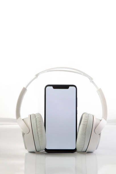 istock White headphones on smartphone music online concept, mockup, isolate on white 1412369798