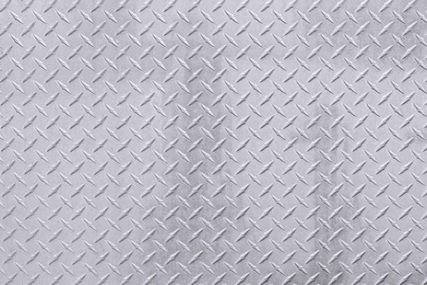 istock Abstract shiny silver metal diamond plate background 1412372196