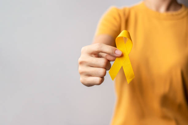 Yellow September, Suicide prevention day, Childhood, Sarcoma, bone and bladder cancer Awareness month, Yellow Ribbon for supporting people life and illness. Healthcare and World cancer day concept Yellow September, Suicide prevention day, Childhood, Sarcoma, bone and bladder cancer Awareness month, Yellow Ribbon for supporting people life and illness. Healthcare and World cancer day concept suicide stock pictures, royalty-free photos & images