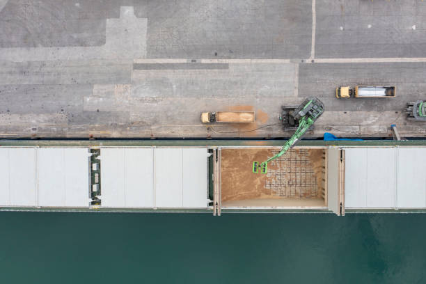 istock Loading trucks in commercial port. 1412375322