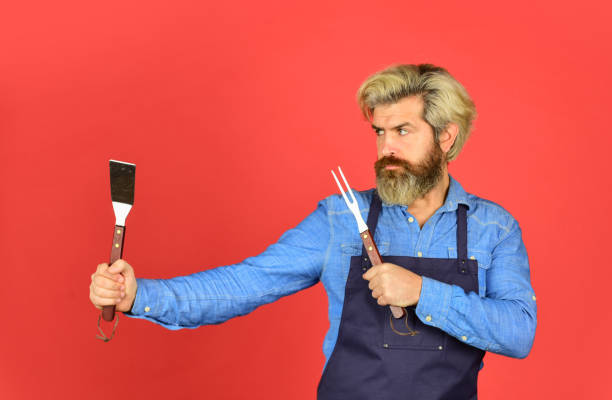 istock Tools for roasting meat. Who cook better. Ultimate cooking challenge. prepare dinner for family. use cooking utensils and various products. mature chef use cooking utensils for barbecue 1412376231