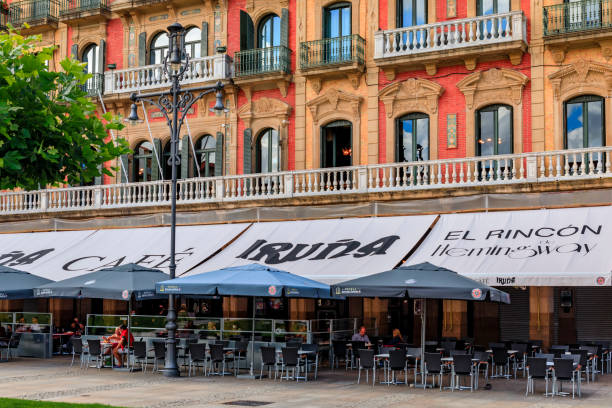 Historic coffee shop Iruna, frequented by Ernest Hemingway in Pamplona, Spain Pamplona, Spain - June 21, 2021: Outdoor terrace of Iruna historic coffee shop frequented by Ernest Hemingway on Plaza del Castillo square in Old Town hemingway house stock pictures, royalty-free photos & images