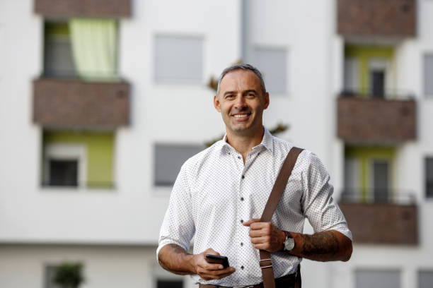 istock Portrait of a handsome smiling man 1412378561