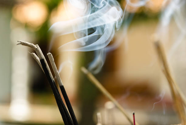 istock Closeup of incense sticks burning in a buddhist temple 1412379470