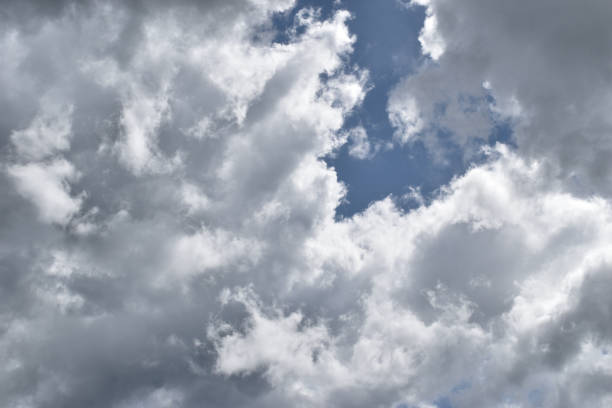 istock Cumulonimbus cloud formations on tropical blue sky 1412380067